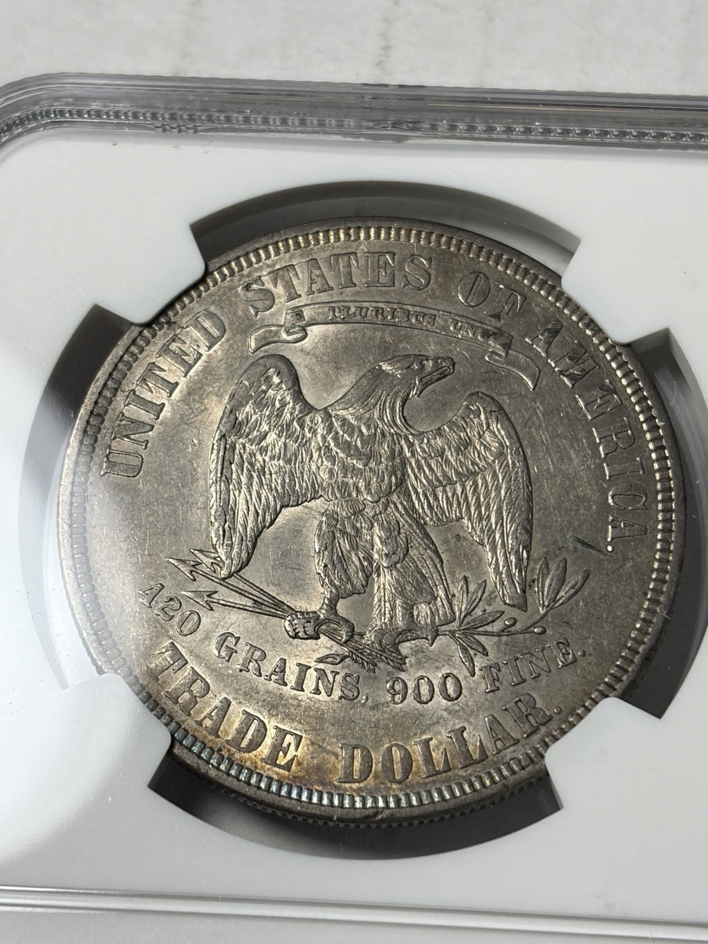 1877 NGC AU55 Trade Silver Dollar Toned