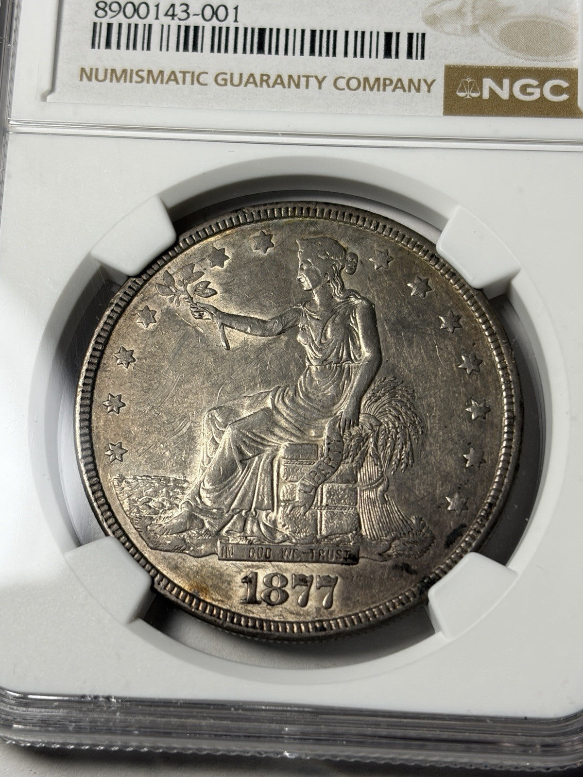 1877 NGC AU55 Trade Silver Dollar Toned