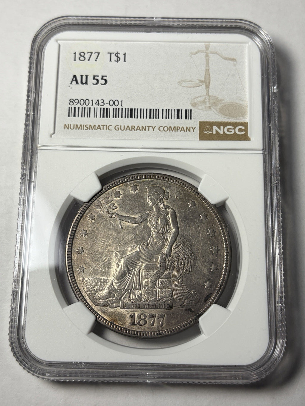 1877 NGC AU55 Trade Silver Dollar Toned