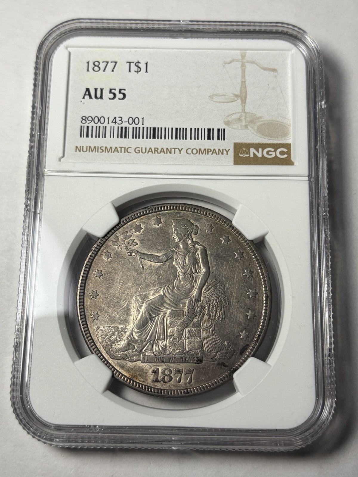 1877 NGC AU55 Trade Silver Dollar Toned
