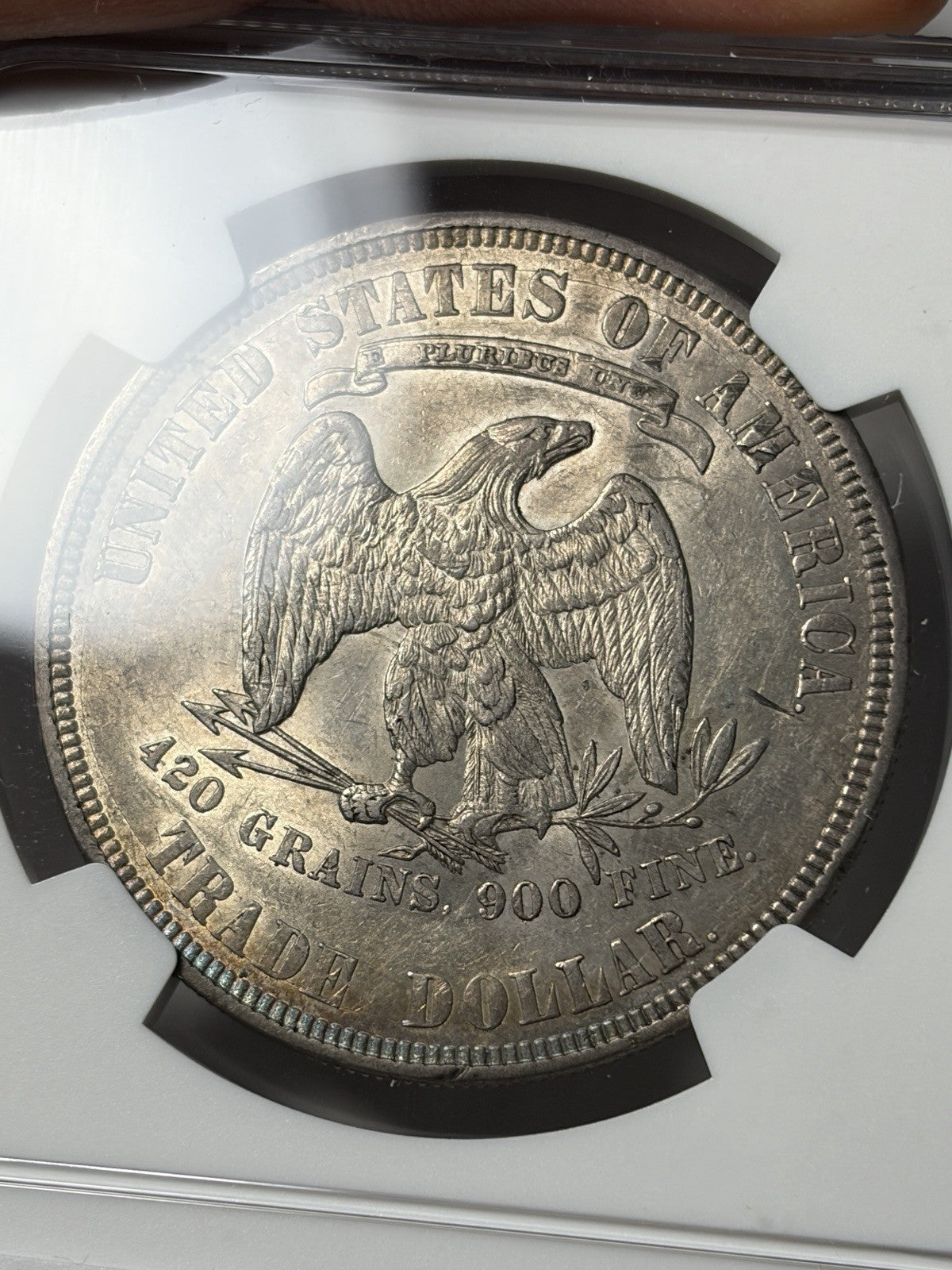 1877 NGC AU55 Trade Silver Dollar Toned
